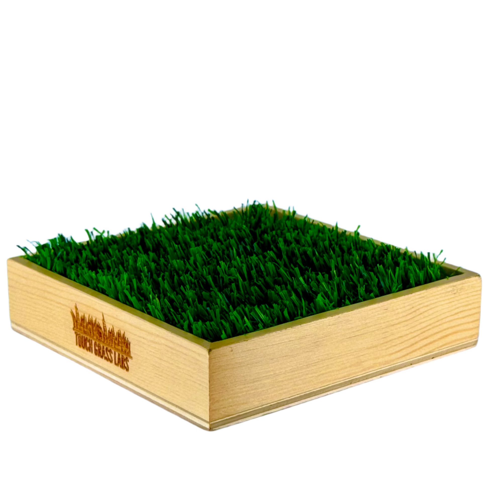 The Touch Grass Classic is a wooden box with artificial grass based on the phrase, "Go Touch Grass," featuring 'Touch Grass Labs' branding.